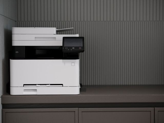 Employee sending fax using online fax services to communicate with coworkers.
